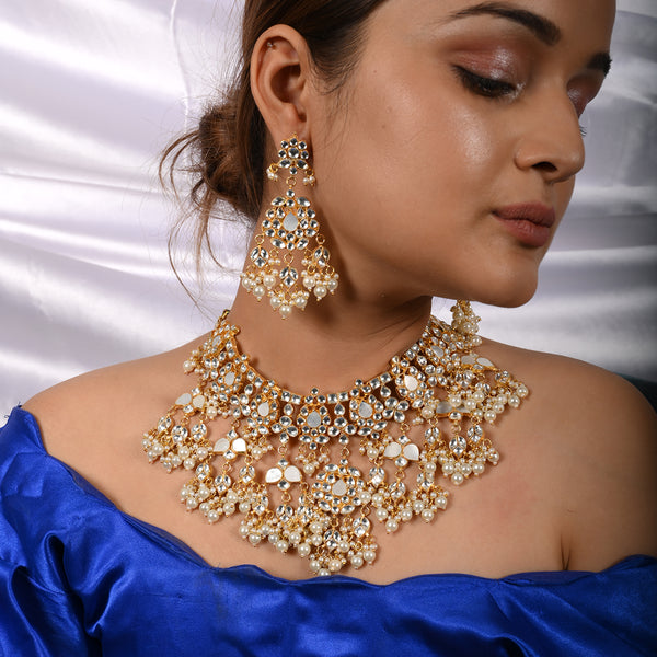 Vrishti Gold Plated Kundan Necklace With Earrings and Tika